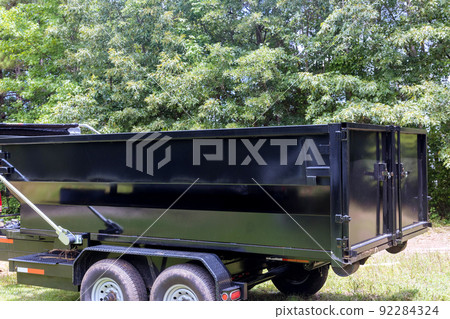 Using a metal container trash dumpster for recycling garbage is considered a good idea 92284324