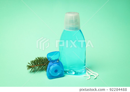 Concept of tooth care on mint background 92284488