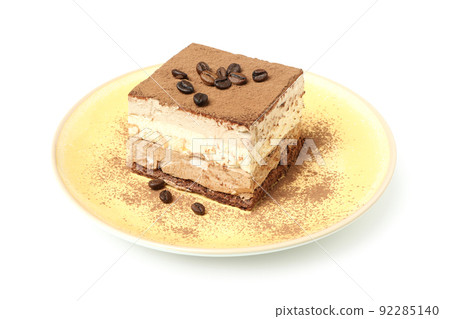 Plate with Tiramisu cake isolated on white background Plate with Tiramisu cake isolated on white background 92285140