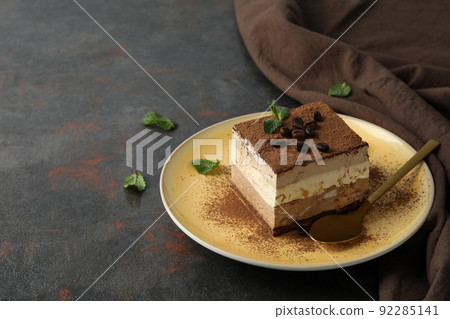 Concept of tasty dessert with Tiramisu cake, space for text Concept of tasty dessert with Tiramisu cake, space for text 92285141
