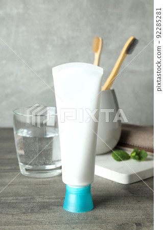 Concept of tooth care on gray wooden table Concept of tooth care on gray wooden table 92285281