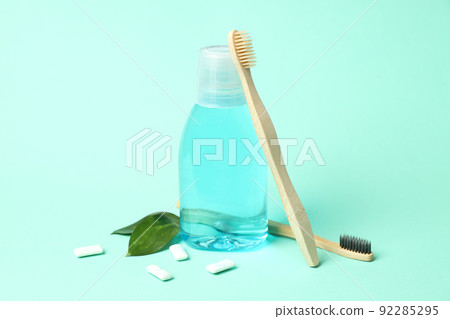 Concept of tooth care on mint background Concept of tooth care on mint background 92285295