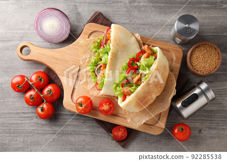 Concept of tasty food with pitas with chicken meat 92285538