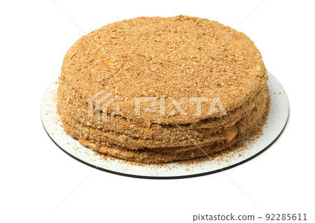 Round honey cake isolated on white background Round honey cake isolated on white background 92285611