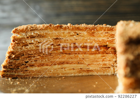 Concept of tasty dessert with honey cake, close up 92286227