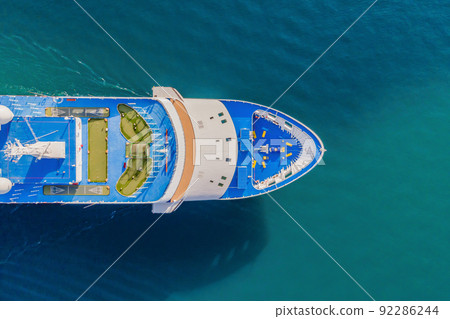 Luxury passenger liner in the bay of Kotor with travel returning after the Covid 19 pandemic Portrait of a disgruntled girl sitting at a cafe table Luxury passenger liner in the bay of Kotor with travel returning after the Covid 19 pandemic Portrait of a disgruntled girl sitting at a cafe table 92286244