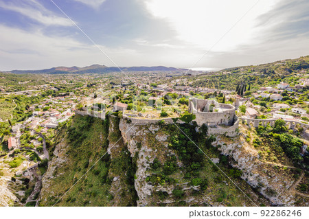 Old city. Sunny view of ruins of citadel in Stari Bar town near Bar city, Montenegro. Drone view Portrait of a disgruntled girl sitting at a cafe table Old city. Sunny view of ruins of citadel in Stari Bar town near Bar city, Montenegro. Drone view Portrait of a disgruntled girl sitting at a cafe table 92286246