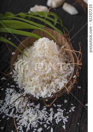 Coconut milk and coconut flakes are tropical foods Coconut milk and coconut flakes are tropical foods 92287210