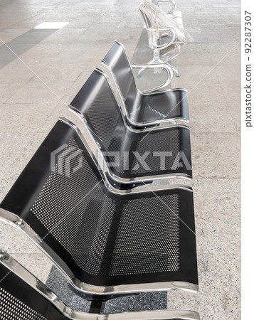 The new modern metal chair is in a row in front of the ticket booth. The new modern metal chair is in a row in front of the ticket booth. 92287307