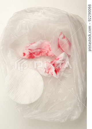 Used cotton pads after removing nail polish in a cellophane bag. Used cotton pads after removing nail polish in a cellophane bag. 92290066