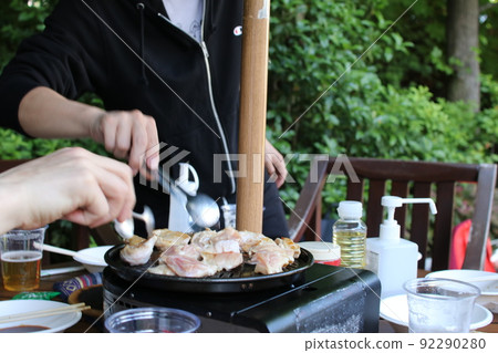 BBQ Men enjoying grilling chicken BBQ Men enjoying grilling chicken 92290280