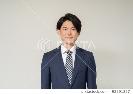 Portrait of young businessman on white background Portrait of young businessman on white background 92291237