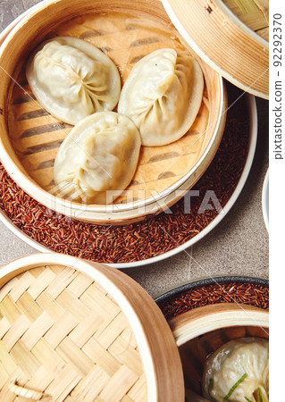 Traditional Asian national food Manti, Manta or Manty, like dumplings in bamboo steamer Traditional Asian national food Manti, Manta or Manty, like dumplings in bamboo steamer 92292370
