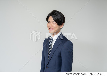 Portrait of young businessman on white background 92292375