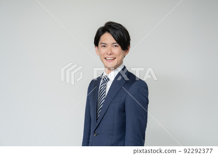 Portrait of young businessman on white background Portrait of young businessman on white background 92292377