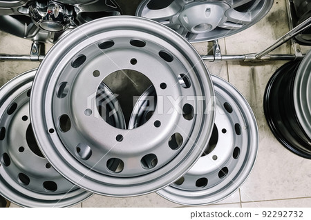 Auto shop selling car rims. Stand for sale of alloy wheels. Discounts at auto parts store. 92292732
