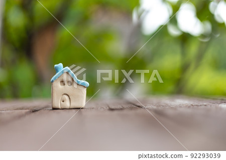 A small cute blue roof pottery house A small cute blue roof pottery house 92293039