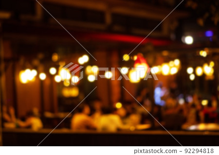 blurred image at the restaurant night time, many people in the restaurant eat and party happy relaxing 92294818