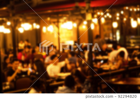 blurred image at the restaurant night time, many people in the restaurant eat and party happy relaxing 92294820