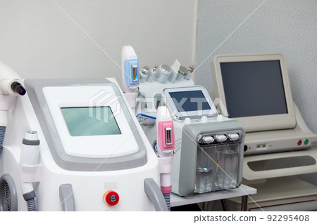 Skin Treatment Laser Equipment. Medical Worker Sets Indices On Screen Of Laser for cosmetic procedures. Close up of Beauty Machine In Cosmetology Center, Beauty Salon. Selective focus Skin Treatment Laser Equipment. Medical Worker Sets Indices On Screen Of Laser for cosmetic procedures. Close up of Beauty Machine In Cosmetology Center, Beauty Salon. Selective focus 92295408
