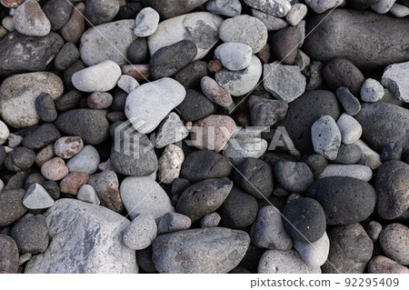 Texture of the seashore with stones. Natural background. 92295409