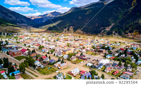 Western town from above surrounded by chain of mountains Western town from above surrounded by chain of mountains 92295504