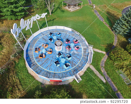 Aerial shot of the bumper car complex with the green lawns surrounding the platform 92295720