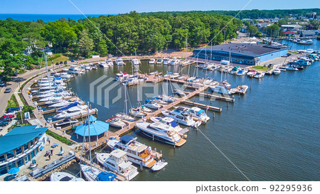 Large dock filled with boats in lake from above aerial Large dock filled with boats in lake from above aerial 92295936