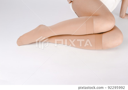 Medical Compression Stockings for varicose veins and venouse therapy. Compression Hosiery. Sock for sports isolated on white background. Black color socks mock up for advertising, branding, design. Medical Compression Stockings for varicose veins and venouse therapy. Compression Hosiery. Sock for sports isolated on white background. Black color socks mock up for advertising, branding, design. 92295992