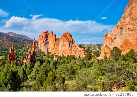 Pillars of red rock in desert mountain landscape with blue sky Pillars of red rock in desert mountain landscape with blue sky 92295993