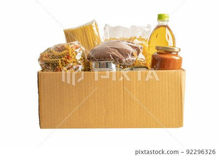 Foodstuff for donation, storage and delivery. Various food, pasta, cooking oil and canned food in box isolated on white background with clipping path. 92296326