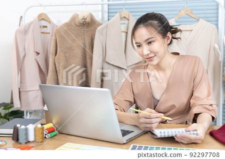 Professional female designers are sketching outfits to suit the needs of their customers, Fashion designer, Creativity and ideas, Mannequin, Shirt sketch, Color scheme, Garment accessories. 92297708