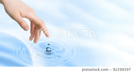 Finger touches water close up. Copy space 92298597