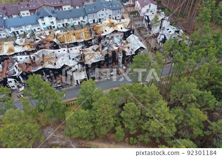 Hostomel, Kyev region Ukraine - 09.04.2022: Top view of the destroyed and burnt houses. Houses were destroyed by rockets or mines from Russian soldiers. Cities of Ukraine after the Russian occupation. Hostomel, Kyev region Ukraine - 09.04.2022: Top view of the destroyed and burnt houses. Houses were destroyed by rockets or mines from Russian soldiers. Cities of Ukraine after the Russian occupation. 92301184