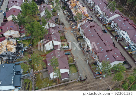 Hostomel, Kyev region Ukraine - 09.04.2022: Top view of the destroyed and burnt houses. Houses were destroyed by rockets or mines from Russian soldiers. Cities of Ukraine after the Russian occupation. Hostomel, Kyev region Ukraine - 09.04.2022: Top view of the destroyed and burnt houses. Houses were destroyed by rockets or mines from Russian soldiers. Cities of Ukraine after the Russian occupation. 92301185