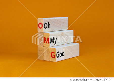 OMG oh my god symbol. Concept words OMG oh my god on wooden blocks on a beautiful orange table, orange background. Business and OMG oh my god concept. Copy space. OMG oh my god symbol. Concept words OMG oh my god on wooden blocks on a beautiful orange table, orange background. Business and OMG oh my god concept. Copy space. 92301598