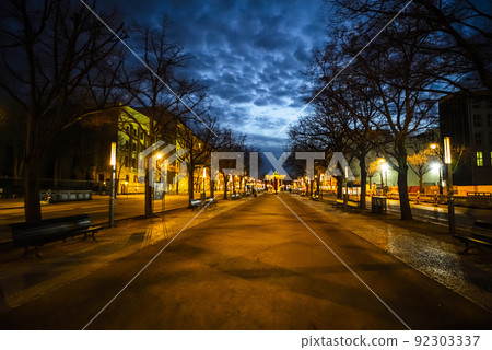 Famous street in Berlin - Unter den Linden with Brandenburg Gate 92303337