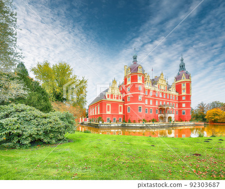 Captivating autumn landscape with Muskau castle. Captivating autumn landscape with Muskau castle. 92303687