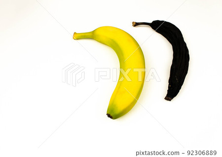 Ripened and fresh banana on white background. Space for text. Yellow banana and black banana Ripened and fresh banana on white background. Space for text. Yellow banana and black banana 92306889