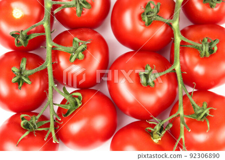 ripe tomatoes on a branch on a white background close-up. healthy vegetables close-up. mockup ingredients for an italian dish. ripe tomatoes on a branch on a white background close-up. healthy vegetables close-up. mockup ingredients for an italian dish. 92306890