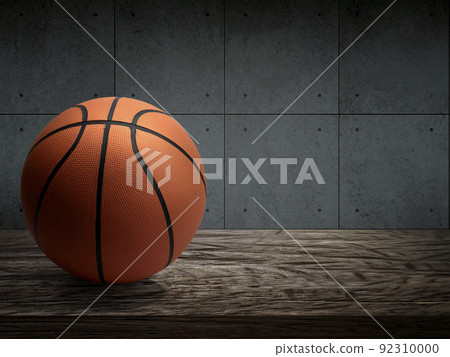 Basketball balls for sports and games are placed on a wooden table with a dark cement wall Basketball balls for sports and games are placed on a wooden table with a dark cement wall 92310000