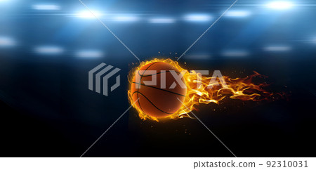 asketball on fire in basketball court stadium with lights in the field shining asketball on fire in basketball court stadium with lights in the field shining 92310031