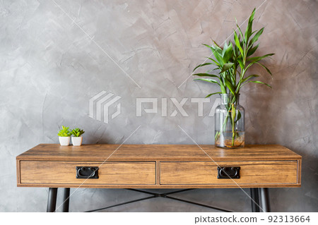 The Empty wooden table vintage with plant pot on concrete wall background. 92313664