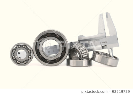 Group of roller bearings and caliper over white Group of roller bearings and caliper over white 92319729