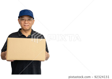 A smiling deliveryman with a cardboard 92324131