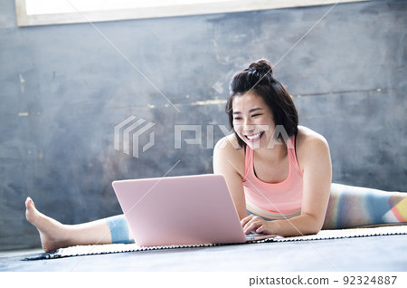 Online yoga class young women Online yoga class young women 92324887