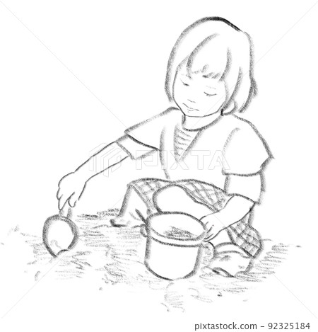 Girl sitting and playing in the sandbox 92325184