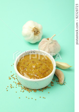 Concept of tasty food with sauce on mint background Concept of tasty food with sauce on mint background 92328723