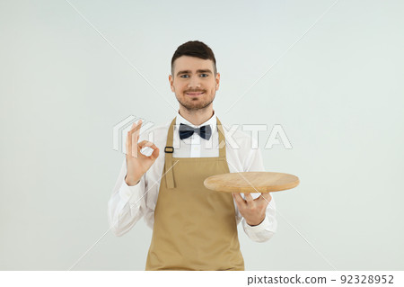 Concept of profession with young man waiter Concept of profession with young man waiter 92328952