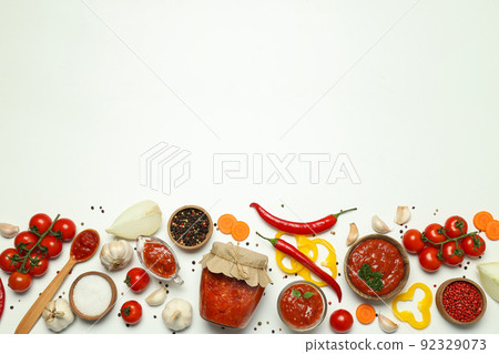 Concept of spicy sauce with Adjika, space for text Concept of spicy sauce with Adjika, space for text 92329073
